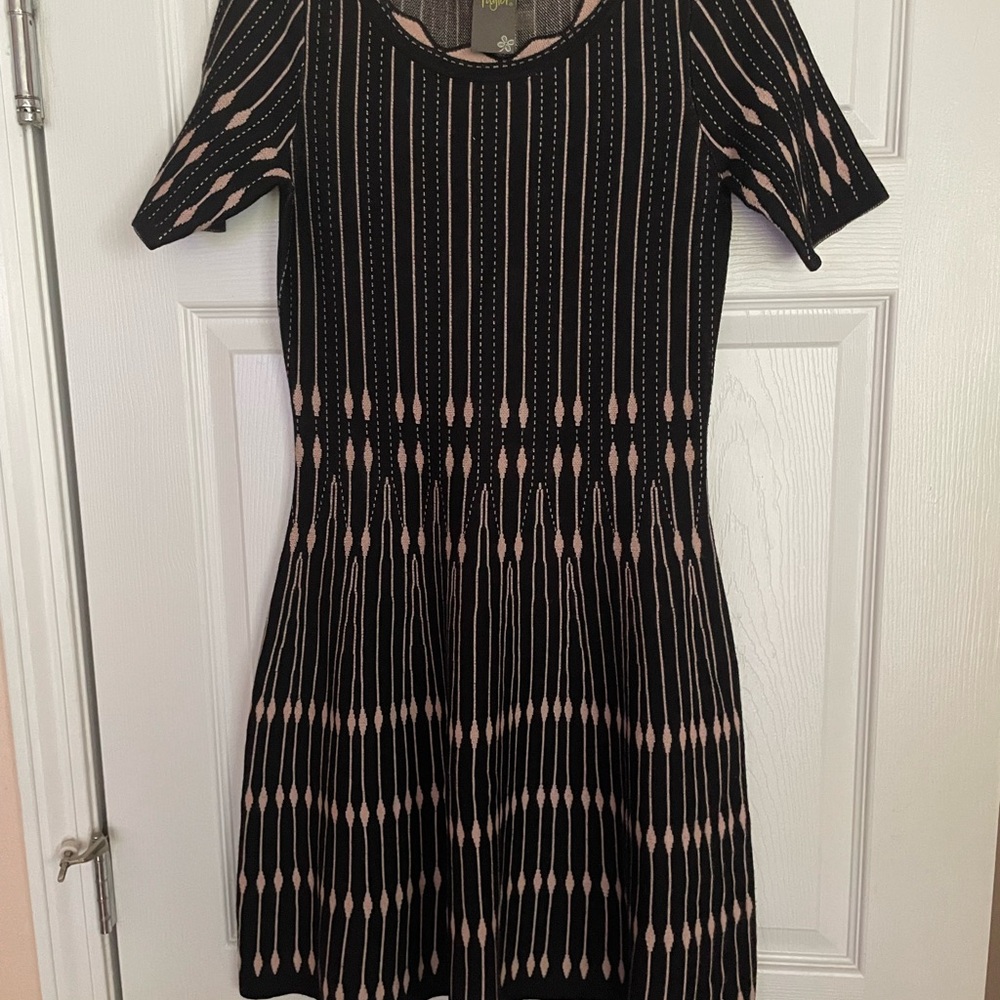 Tan and black dress rayon and polyester.